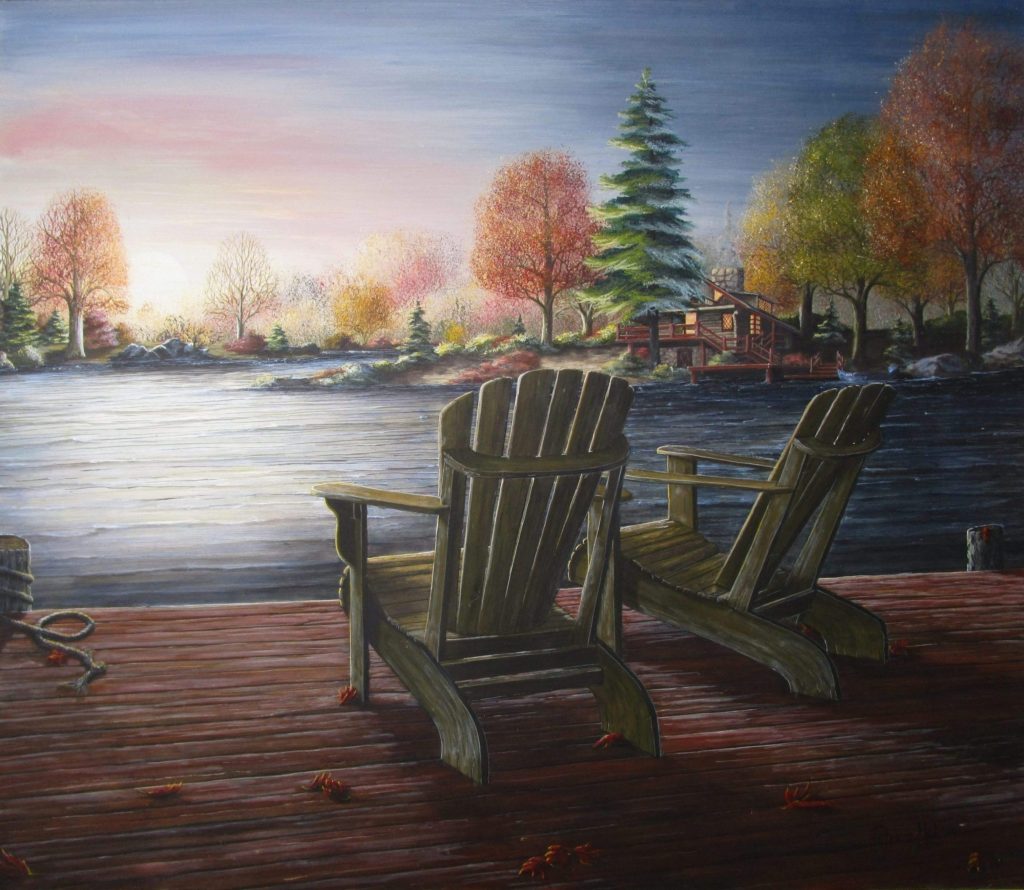 This beautifully peaceful fall art print has two chairs on a deck at a lake with the sun setting on the other side. This piece will take you away to a quiet place.