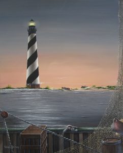 "The Guiding light" a nautical art print of the Cape Hatteras Lighthouse on the North Carolina Outer Banks. The view is as if you were standing on a fishing boat on the way in after a long day as the sunsets behind the lighthouse.